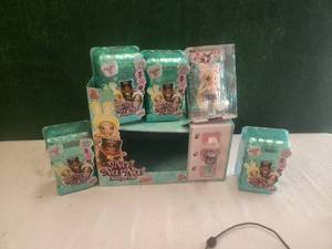 lot 188 image: Na Na Na Surprise doll store display and unopened dolls