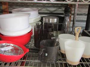 lot 48 image: kitchen lot- mixing bowls, measuring cups, pot strainer and more