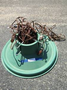 lot 54 image: green Christmas tree stand and various extension cords