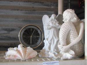 lot 69 image: table clock, mermaid figurine, light up angel, sea shells
