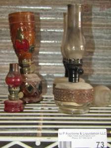 lot 73 image: various size oil lamps