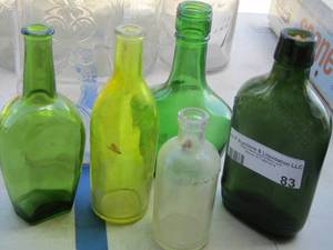 lot 83 image: vintage green bottles