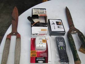 lot 120 image: qty 2 pair  of tree trimmers, TV remote, delta door knob, outlet plug