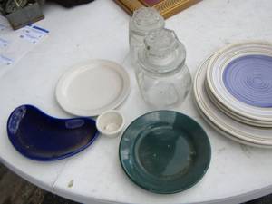 lot 129 image: 2 canisters with lids, dinner plates, saucers, green plate, half moon blue plate and more