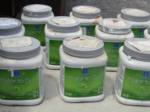 lot 165 image: various small sample bottles of paint all opened and used still has some left mostly white