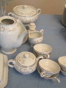 lot 3 image: Sheffield Fine China CLASSIC 501 serving pieces -, Covered Casserole dish, Tea pot, Butter dish, CREAMER & SUGAR , Gravy boat, salt and pepper shakers, and 6 handled tea cups