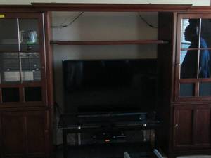 lot 312 image: TV Livingroom entertainment center very nice lots of space, comes apart in 3 pieces east assemble -