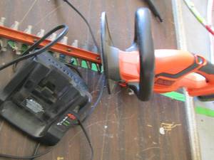 lot 270 image: Black and Decker hedge trimmer with charger and battery