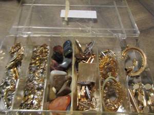 lot 172 image: small storage full of jewelry making items and a few stone- includes shirt pins with metal frames