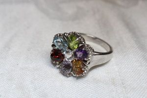 lot 34 image: Sterling Silver - marked 925 PS Thailand Multi gemstone cluster ring size 10 weighs 8g