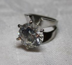 lot 53 image: Sterling Silver - round clear stone ring, size 5 weighs 11g