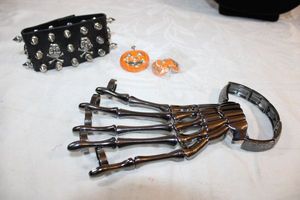 lot 10 image: Halloween jewelry - skeleton hand stretch bracelet, Skull and spike wide bracelet, Enamel Jack O Lantern brooch and earring set