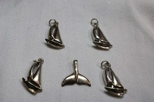 lot 85 image: Sterling Silver - Sailboats and whale tail pendants, see photos