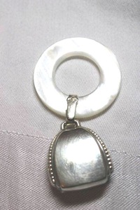 lot 89 image: Sterling Silver - pearl teething ring with silver pouch