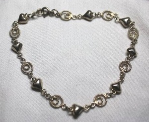 lot 103 image: Sterling Silver - Heart and swirl bracelet