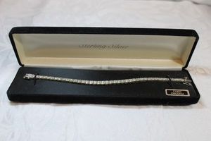 lot 105 image: Sterling Silver - CZ tennis bracelet marked 925 FAS with jewelry bracelet box