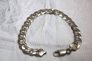 lot 107 image: Sterling Silver - Chain link bracelet with lobster clasp, marked Italy 925 LIRM, weight 16.9g