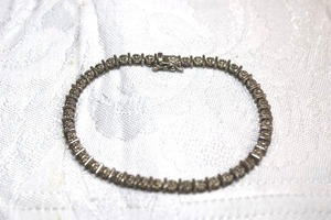 lot 108 image: Sterling Silver - Silver tennis bracelet marked 925 China, weight 10.6g