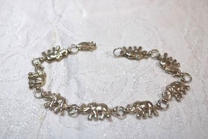 lot 110 image: Sterling Silver - Elephant charm link bracelet each elephant marked 925, weight 10g