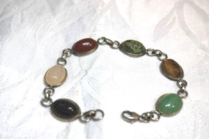 lot 114 image: Sterling Silver - multi gemstone link bracelet, each link setting marked 925