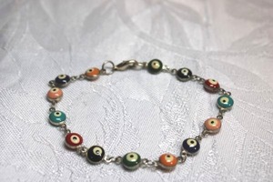 lot 127 image: Sterling Silver - Evil Eye and Silver chain link bracelet, muted colors
