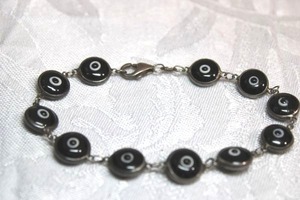lot 129 image: Sterling Silver - Evil Eye and Silver chain link bracelet, black and white colors