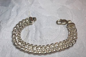 lot 130 image: Double chain link bracelet with lobster clasp, marked 925, weight 20g