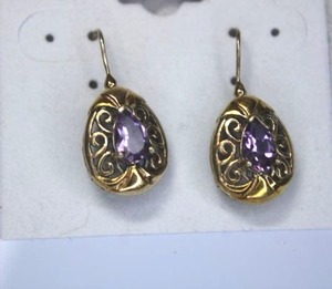 lot 78 image: Sterling Silver - Gold tone egg shaped earrings with purple stone