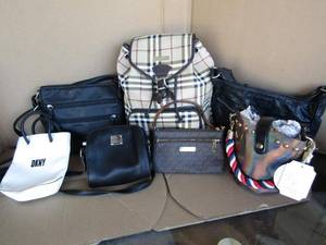 lot 300 image: Name brand purses, clutches and backpack including DKNY, Tyler Rodan, Michael Kors, Burberry, plus