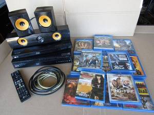 lot 301 image: 2 LG Blu-ray players, LG speaker system, and assorted Blu-ray DVDs