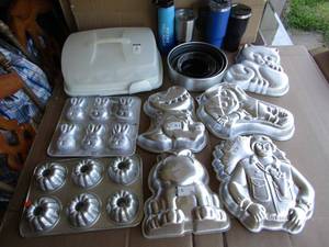 lot 324 image: Assorted theme shaped cake tins plus