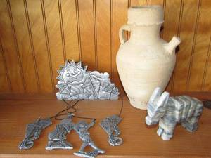 lot 360 image: Soap stone donkey and vintage style oil vase, plus an aluminum wind chime