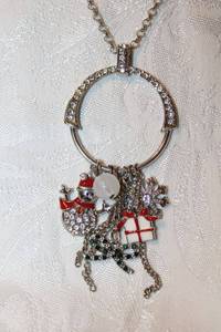 lot 297 image: Silver finish cable necklace with enamel dangles. Includes snowman, Bow, Star, Gift. 32L with 4 extender, Pendant drop 3.5L