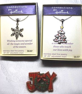lot 284 image: (3) Hallmark branded items. (2) necklaces in boxes and a Hallmark Joy broochpin (marked Hallmark Cards Inc.