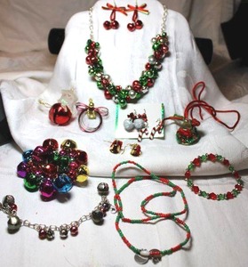 lot 282 image: Jingle Bell themed jewelry selection. Includes necklace, stretch bracelet, earrings and more