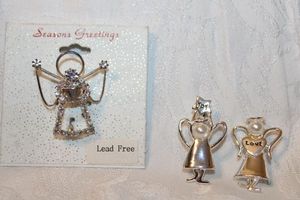 lot 278 image: (3) Angel pins. Includes Love and Joy faux pearl angel pins and rhinestone decorated angel pin on card. 1.5H