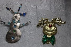 lot 265 image: (2) Holiday broochespins. Smiling reindeer 2H x 2W and Snowman 3H x 2.25W