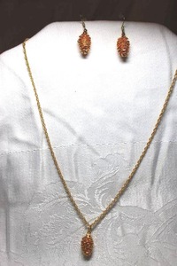 lot 264 image: Golden pine cone nature pendant necklace with matching ear wire earrings. 18L chain with spring ring clasp. Earrings 1.5L