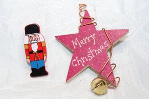 lot 258 image: (2) Wood broochpins. Merry Christmas Star 3H x 2W and Nutcracker 2H