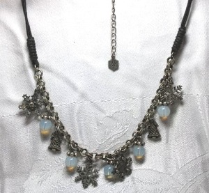 lot 235 image: Metal snowflake charm and glass bead choker necklace with woven cord yoke. Lobster clasp. 14L with 2 extender and snowflake end cap