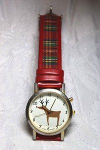 lot 225 image: Tartain plaid strap holiday watch with reindeer motif.