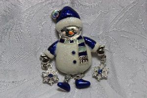 lot 237 image: Signed Kenneth Cole enamel snowman broochpin. Marked KC on reverse. 2.25H