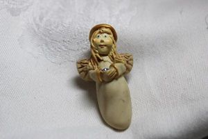 lot 230 image: 1998 Touchstone angel broochpin with blue crystal. 2H