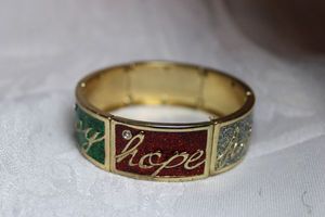 lot 229 image: Red green and white glitter enamel panel stretch bracelet Joy, Faith, Hope