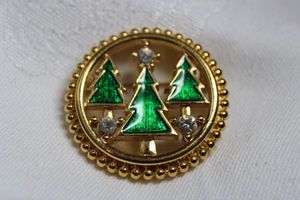 lot 238 image: Signed Monet enamel round broochpin with pine trees and crystals. Marked Monet on reverse. 1.5W