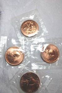 lot 207 image: Rose gold colored commemorative coins - (3) Veterans National Medal coins, (1) Navajo code talkers coin