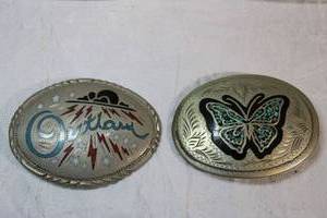 lot 200 image: Stone inlay belt buckles - One has Outlaw in blue, the other with butterfly motif.
