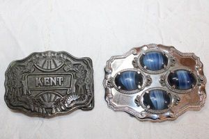lot 198 image: Silver tone belt buckles - One with the word Kent, the other has 4 blue beads