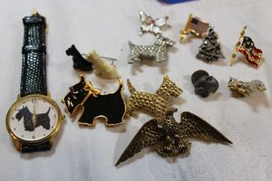 lot 210 image: Lapel pins and tie tacks. Lots of Scotty dogs including watch.