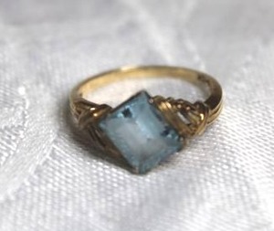 lot 201 image: Ring with blue stone with diagonal setting (looks like blue topaz but untested) marked B-10K. Size 5.5 please preview.